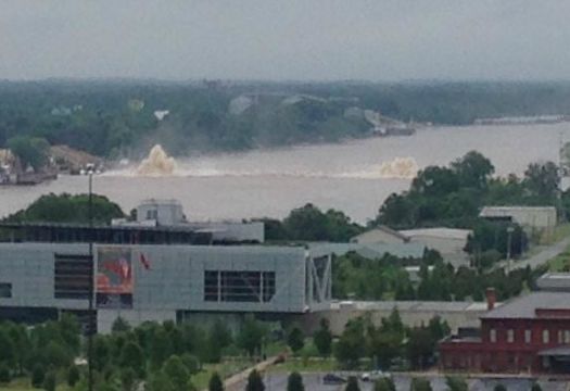 With the Clinton Presidential Center in the foreground, this photo shows a Spectra Energy pipeline blowout beneath the Arkansas River in Little Rock on May 31. Photo Courtesy: Tony Cassady
